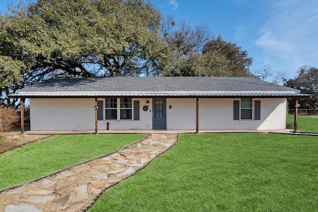 ranch-style home featuring a front yard