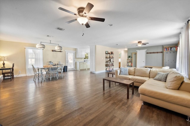 207 Granbury Ct, Granbury, TX 76049 - living area with a ceiling fan, dark wood-style floors, and baseboards