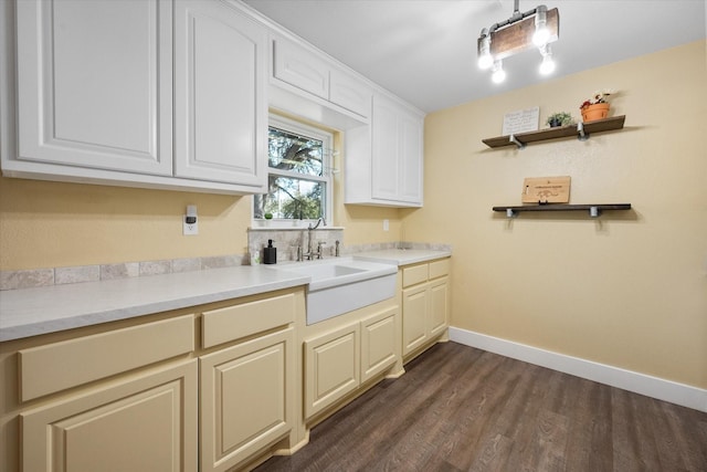 207 Granbury Ct, Granbury, TX 76049 - kitchen featuring a sink, dark wood-type flooring, baseboards, light countertops, and open shelves