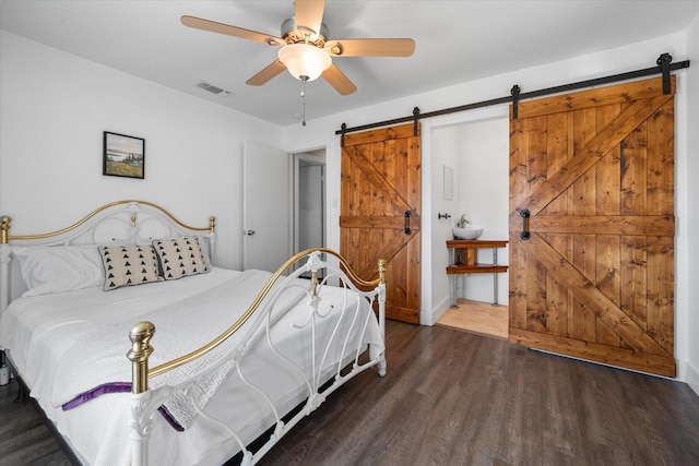 207 Granbury Ct, Granbury, TX 76049 - bedroom featuring a barn door, wood finished floors, and ceiling fan
