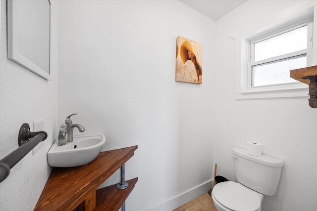 207 Granbury Ct, Granbury, TX 76049 - half bathroom with toilet, vanity, and baseboards