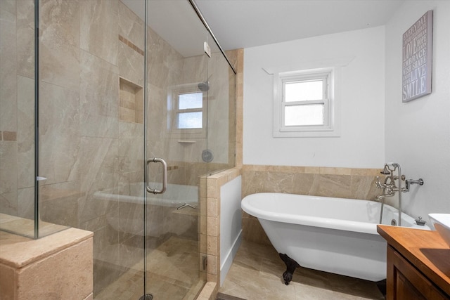 207 Granbury Ct, Granbury, TX 76049 - bathroom featuring a soaking tub, vanity, a shower stall, and tile walls
