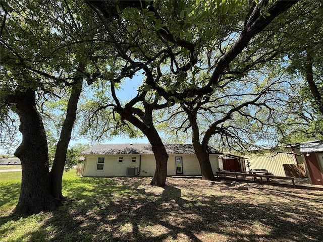 207 Granbury Ct, Granbury, TX 76049 - rear view of house featuring central air condition unit