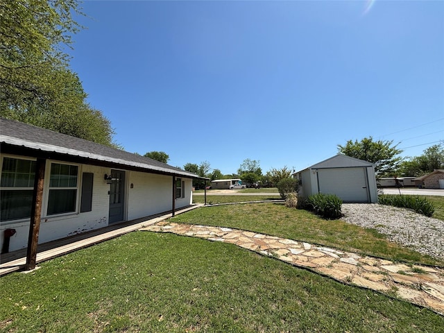 207 Granbury Ct, Granbury, TX 76049 - view of grassy yard with a detached garage and an outbuilding