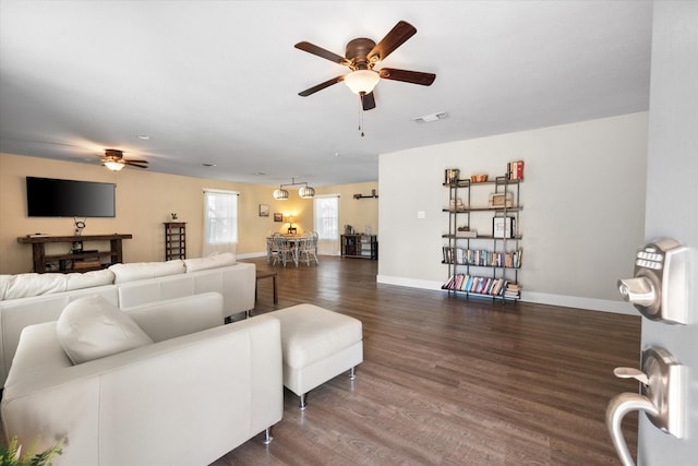 207 Granbury Ct, Granbury, TX 76049 - living area with a ceiling fan, dark wood-type flooring, and baseboards
