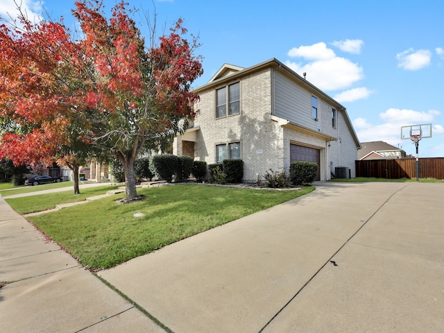 view of home's exterior featuring cooling unit, a garage, and a yard