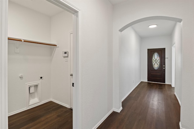 interior space with hookup for an electric dryer and dark hardwood / wood-style flooring