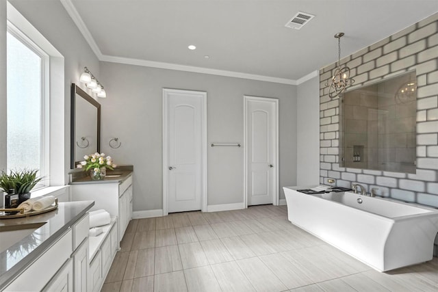 bathroom featuring visible vents, a freestanding bath, two vanities, and ornamental molding