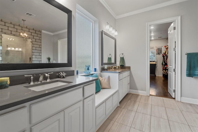 bathroom with ornamental molding, a shower, tile patterned floors, and vanity