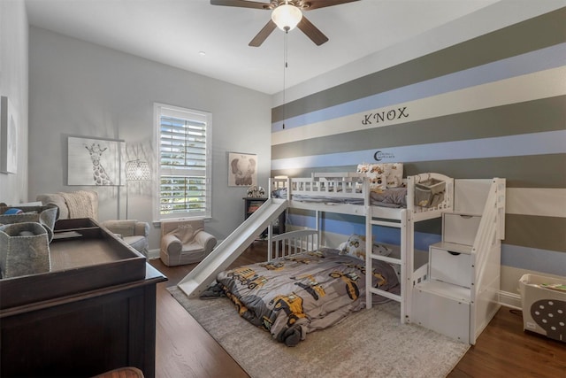 bedroom with ceiling fan and wood finished floors