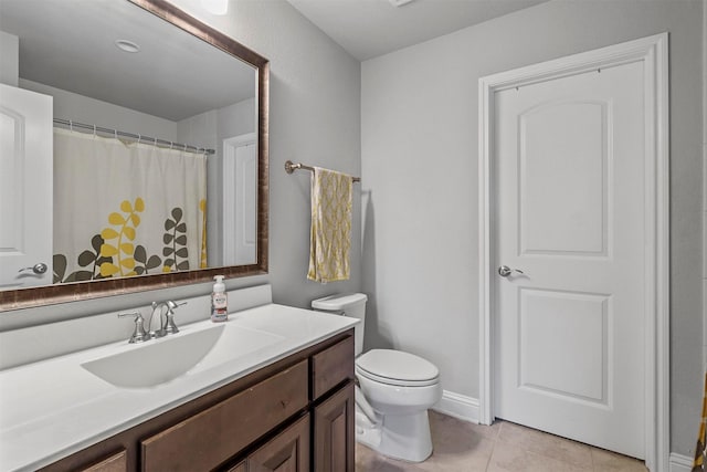 bathroom featuring a shower with curtain, vanity, toilet, and tile patterned flooring