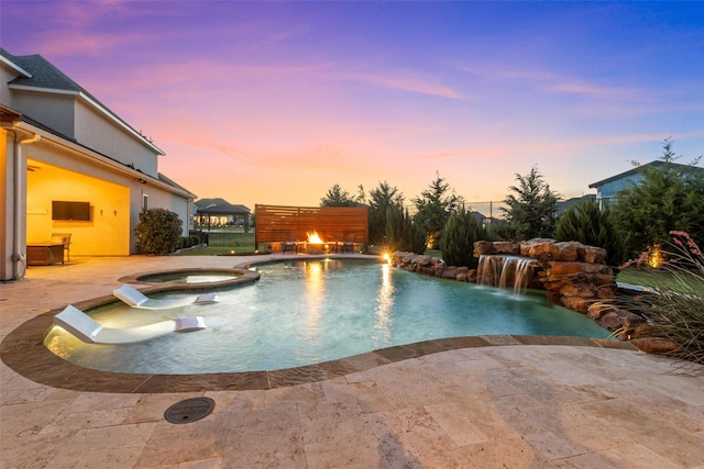 view of swimming pool featuring a patio and a pool with connected hot tub