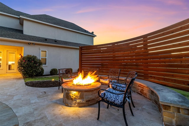 patio terrace at dusk with a fire pit