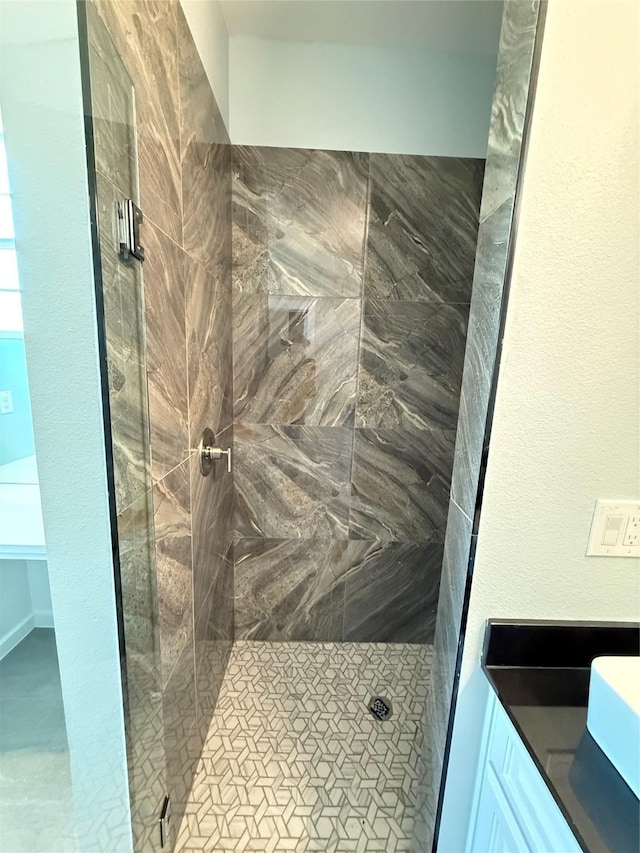 bathroom with tiled shower