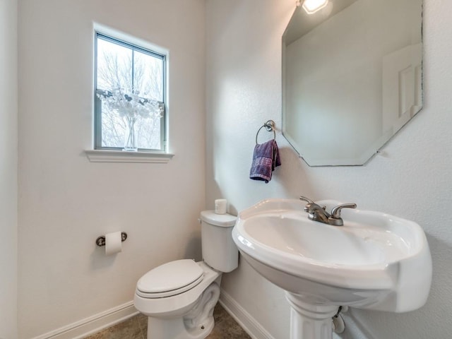 bathroom with toilet and sink