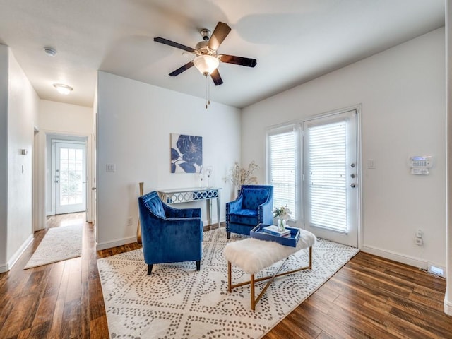 sitting room featuring ceiling fan and wood-type flooring