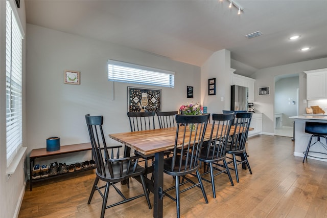 dining room with light hardwood / wood-style flooring