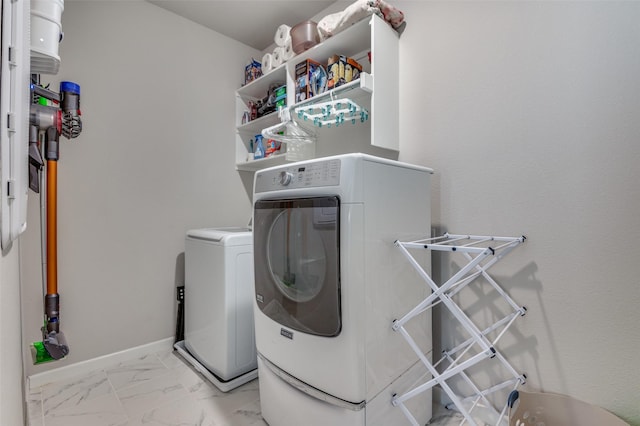 washroom featuring washing machine and dryer