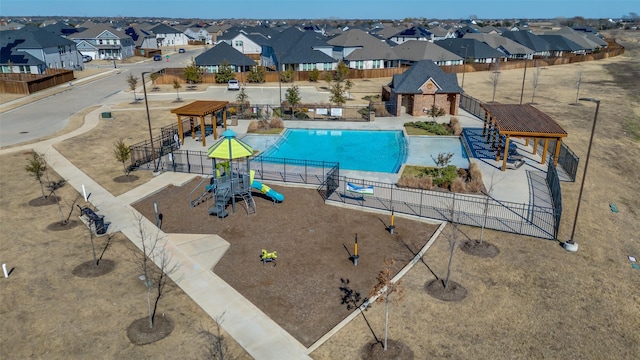 view of pool featuring a playground