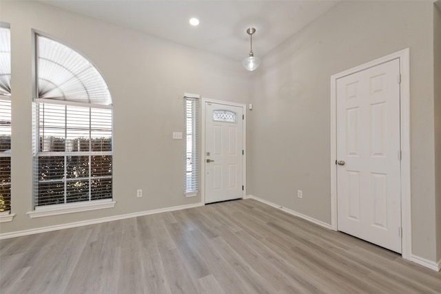 foyer entrance with light wood-type flooring