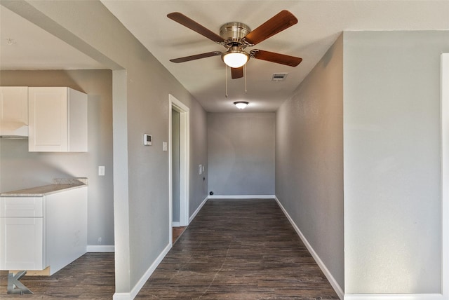 corridor featuring dark hardwood / wood-style floors