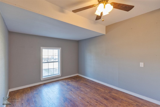 unfurnished room featuring ceiling fan and dark hardwood / wood-style floors