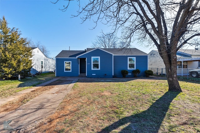 ranch-style home featuring a front yard