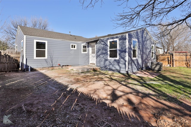 rear view of house featuring cooling unit