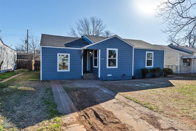 ranch-style home featuring a front yard