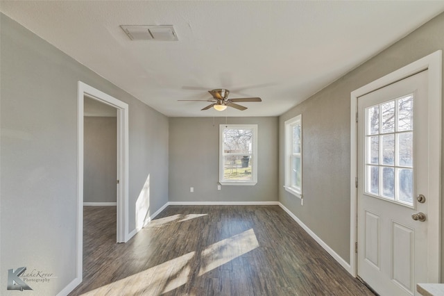 foyer with ceiling fan and dark hardwood / wood-style floors