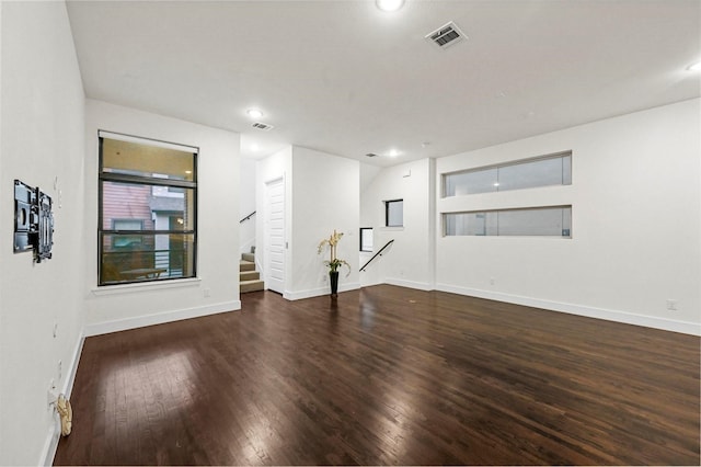 empty room with dark hardwood / wood-style floors