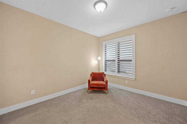 unfurnished room featuring light colored carpet