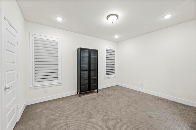 empty room featuring carpet flooring