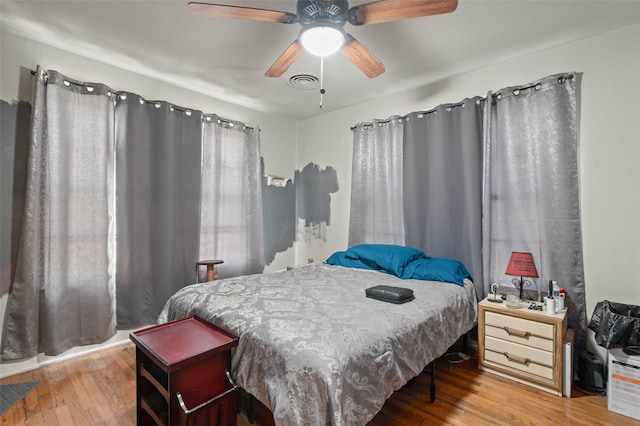 bedroom featuring ceiling fan and hardwood / wood-style floors