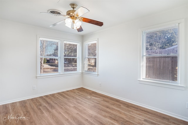 empty room with ceiling fan and light wood-type flooring