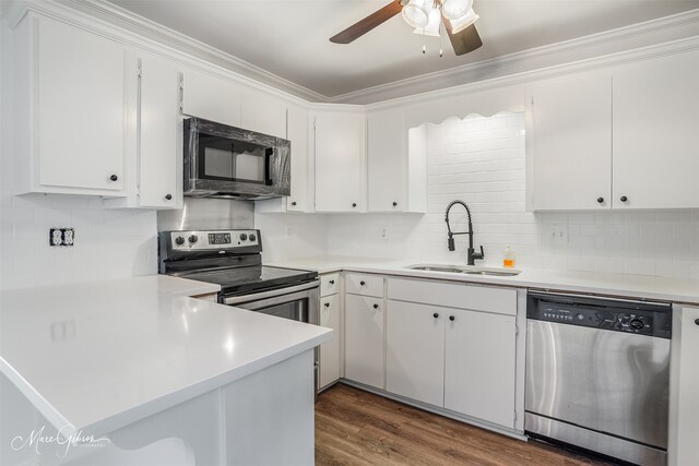 kitchen featuring white cabinetry, sink, stainless steel fridge, and light hardwood / wood-style flooring