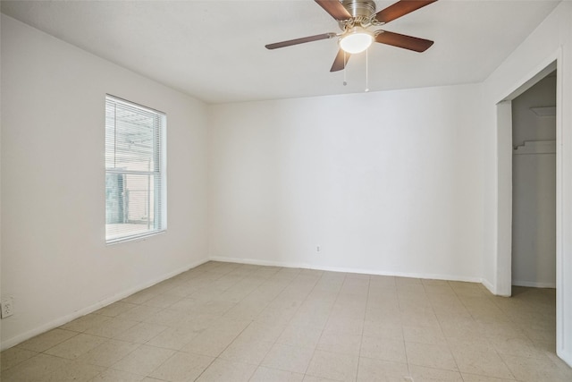 unfurnished bedroom featuring ceiling fan and a closet