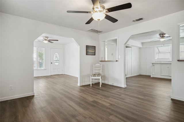 unfurnished living room featuring dark hardwood / wood-style floors