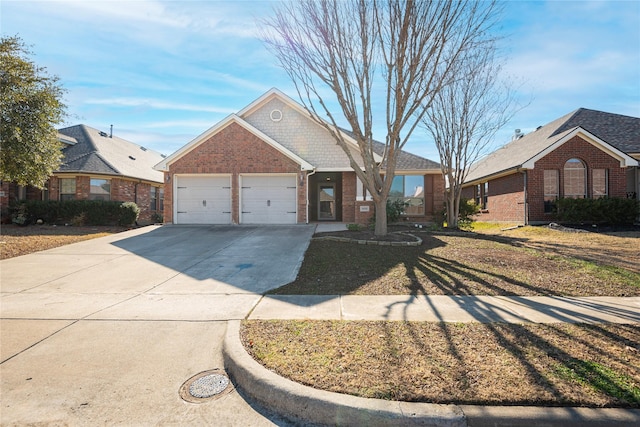 single story home featuring a garage and a front lawn