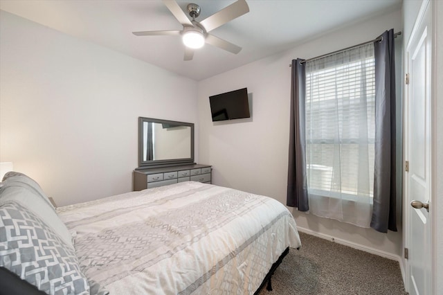 bedroom featuring ceiling fan and carpet