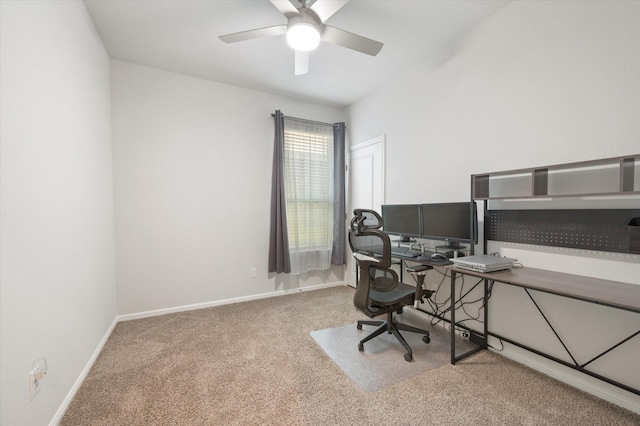 carpeted office featuring ceiling fan