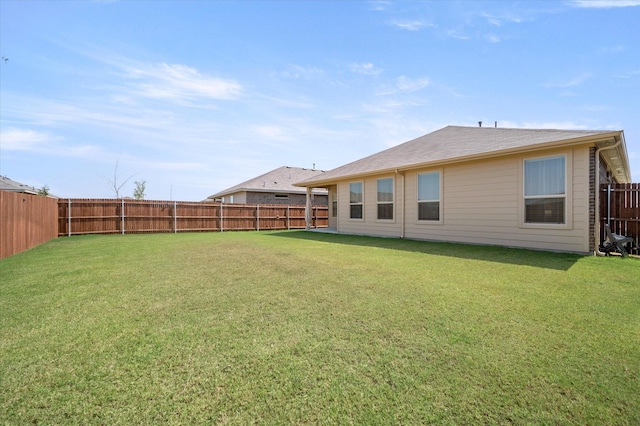 back of house with a yard