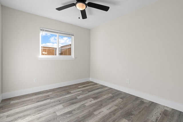 unfurnished room with ceiling fan and light wood-type flooring