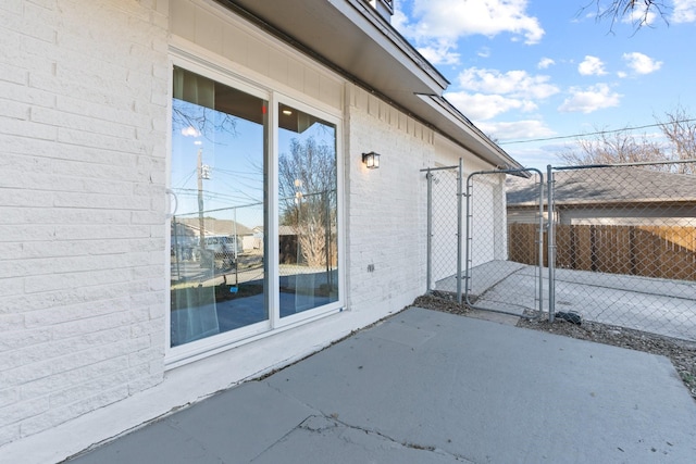 view of side of home featuring a patio area