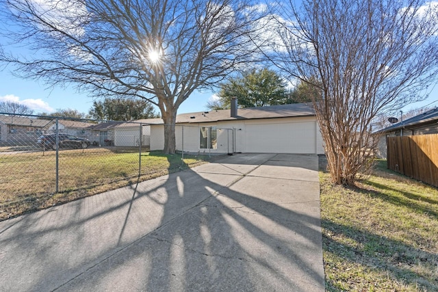 ranch-style home with a garage and a front yard