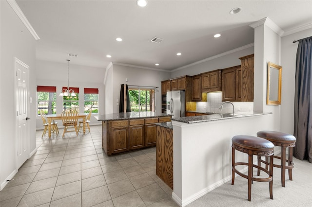 1417 Flying Jib Dr, Azle, TX 76020 - kitchen featuring stainless steel fridge, recessed lighting, crown molding, healthy amount of natural light, and a peninsula