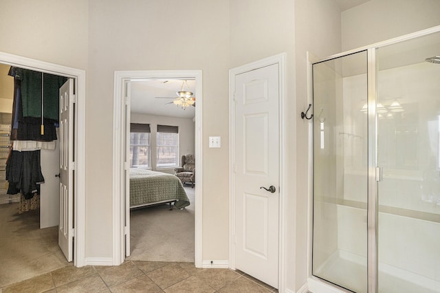 bathroom with tile patterned floors and an enclosed shower