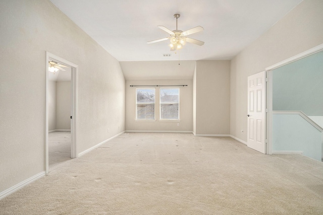 unfurnished room with light colored carpet and ceiling fan