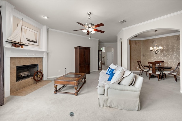 1417 Flying Jib Dr, Azle, TX 76020 - living area with arched walkways, a ceiling fan, carpet flooring, ornamental molding, and a fireplace