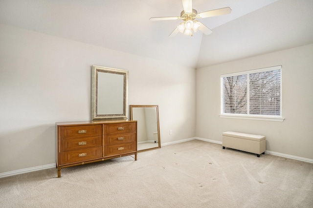 unfurnished bedroom with vaulted ceiling, light carpet, and ceiling fan